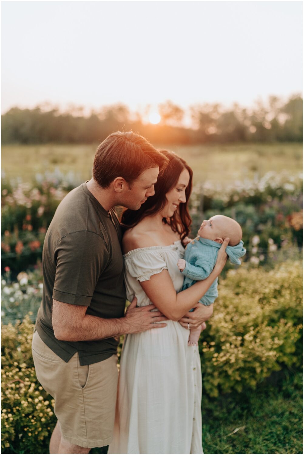 Edmonton family photographer session in a flower farm with a newborn